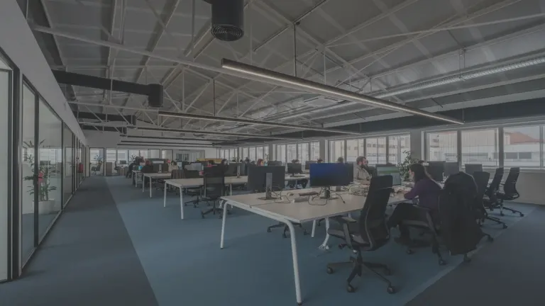 Modern open-plan office with people working