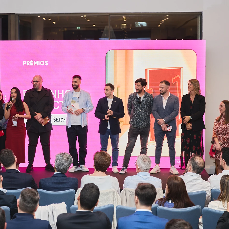 Group receiving awards on stage.