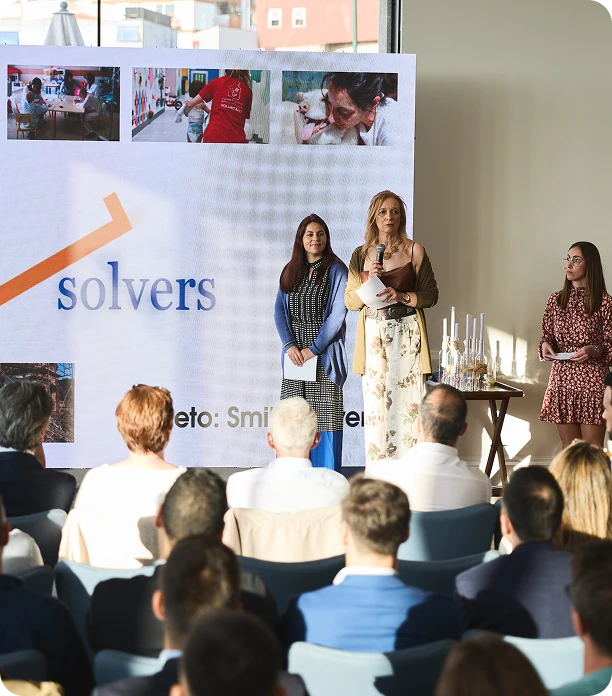 Presentation at Solvers event with audience.